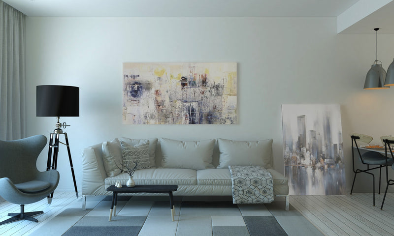 living room with couch, carpet, table and other décor.