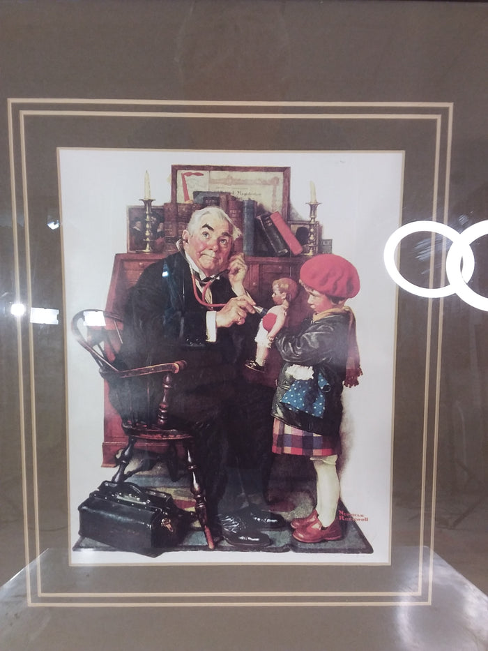 Norman Rockwell's 'The Doctor And The Doll' Framed Print