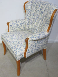 White Armchair with Blue Leaf Detail