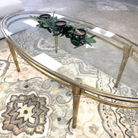 54.5-Inch W Oval Coffee Table – Brushed Brass Frame with Glass Insert