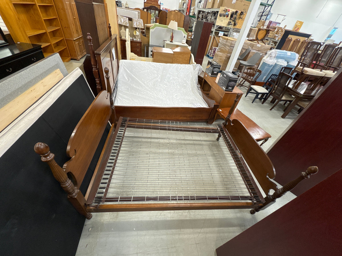 Vintage Wooden Bed Frame with a Cannonball Poster Design and an Integrated Wire Spring Base.