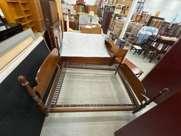 Vintage Wooden Bed Frame with a Cannonball Poster Design and an Integrated Wire Spring Base.