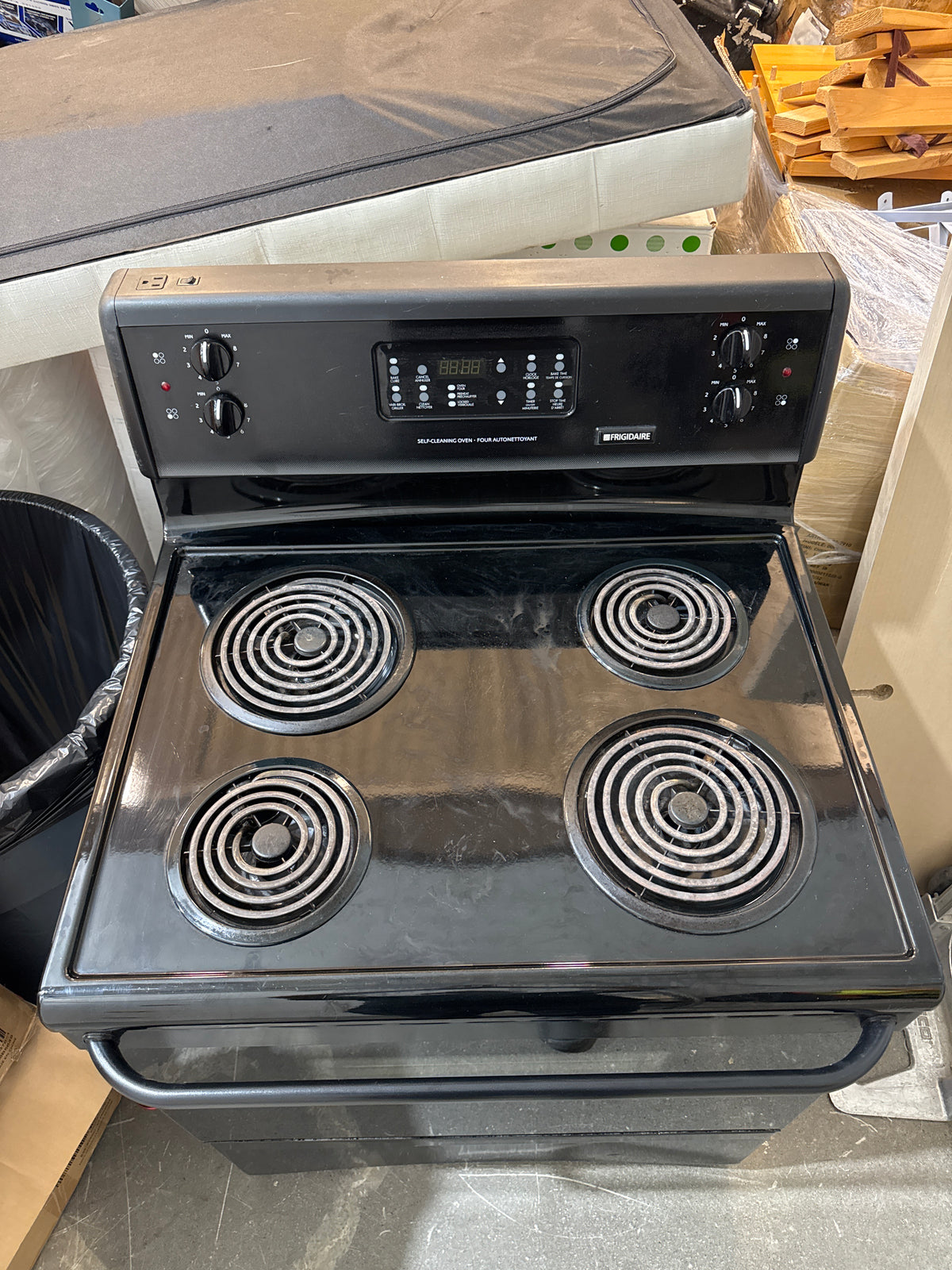 Frigidaire Freestanding Electric Range Features a 4-Burner Coil Cooktop, Electronic Oven controls, and a self-cleaning function.