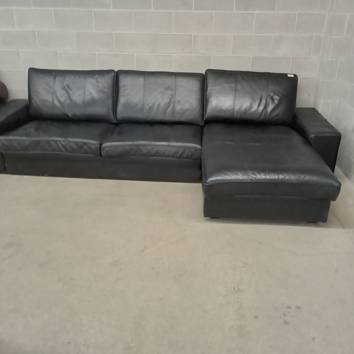 125"W 2-Piece Black Leather Sectional Sofa