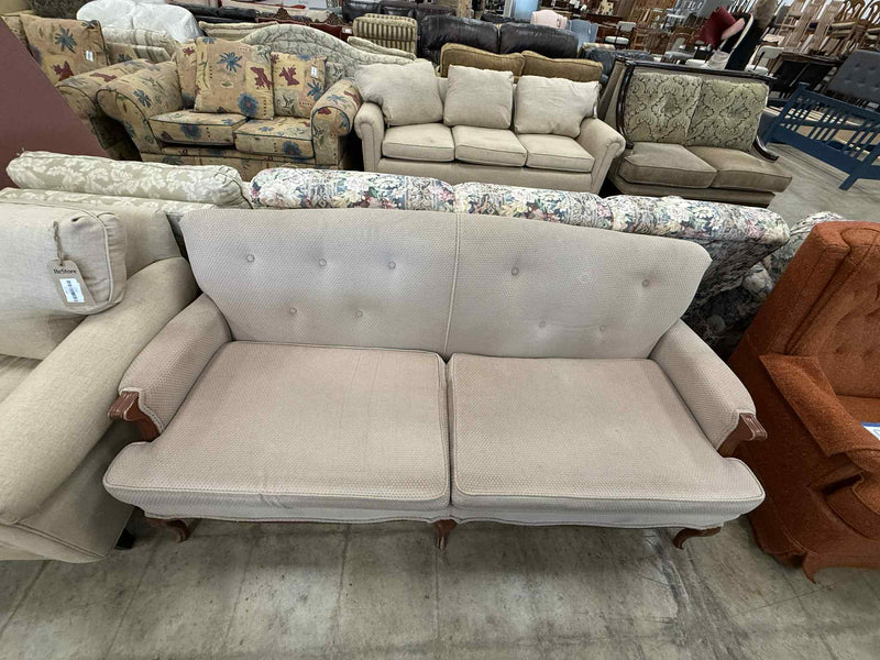 Light Colored Two-Seater Sofa