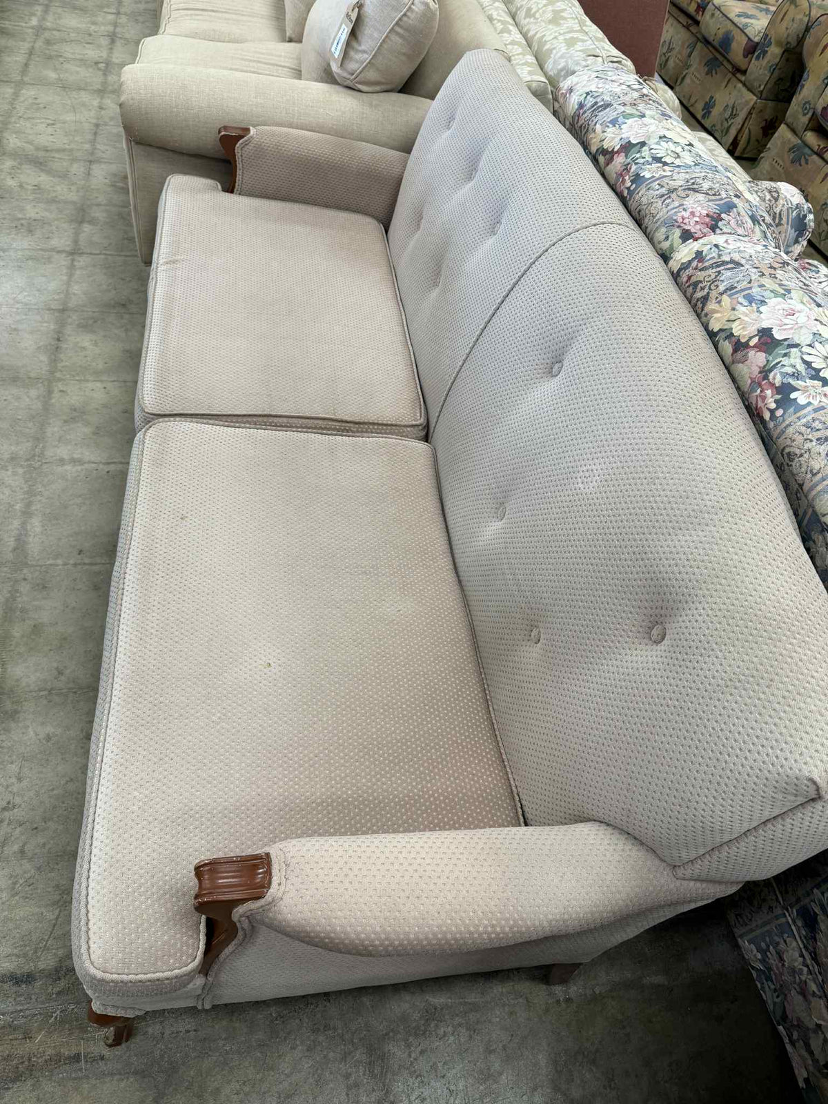Light Colored Two-Seater Sofa