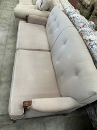 Light Colored Two-Seater Sofa