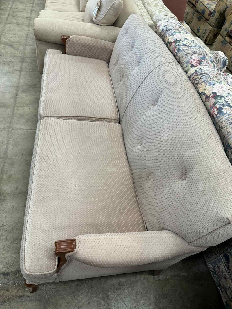 Light Colored Two-Seater Sofa