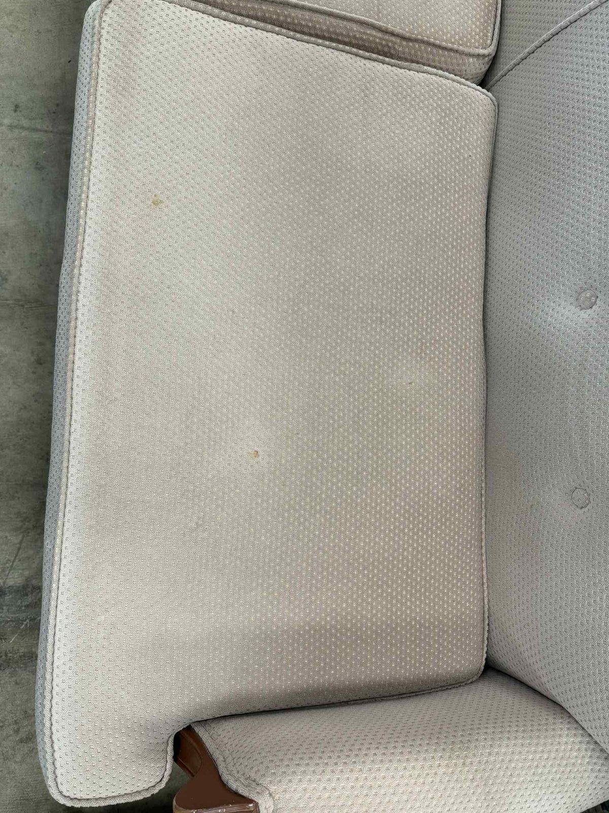 Light Colored Two-Seater Sofa