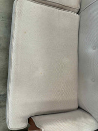 Light Colored Two-Seater Sofa