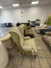 Light Colored Upholstered Wingback Armchair