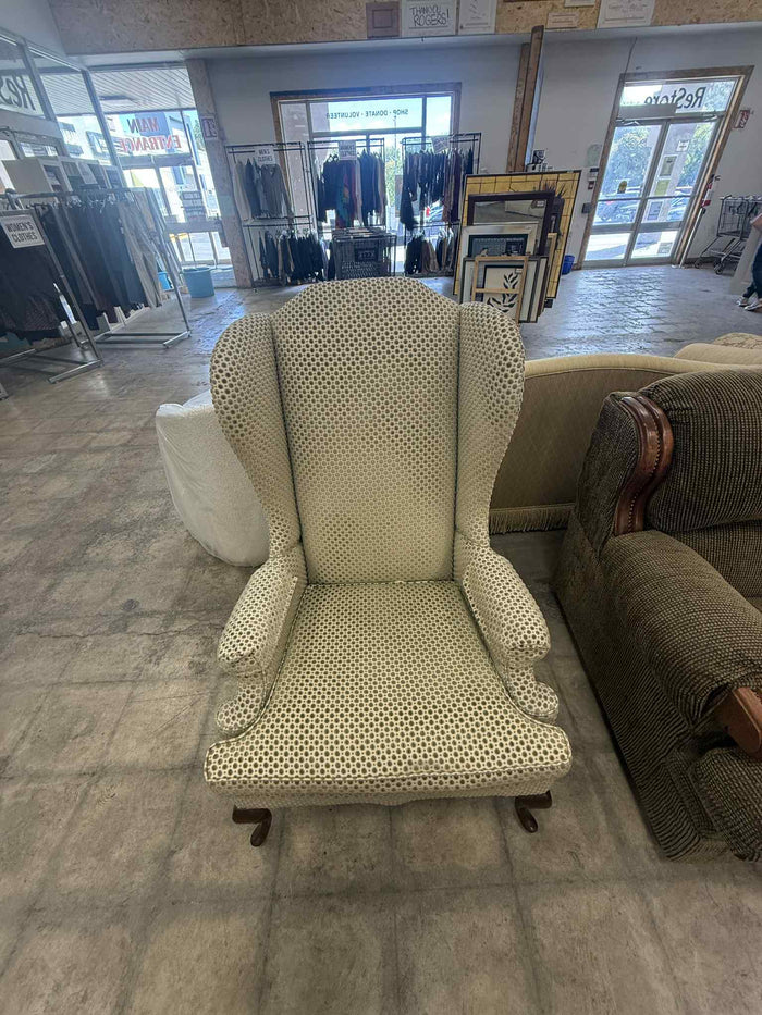 Light Colored Upholstered Wingback Armchair