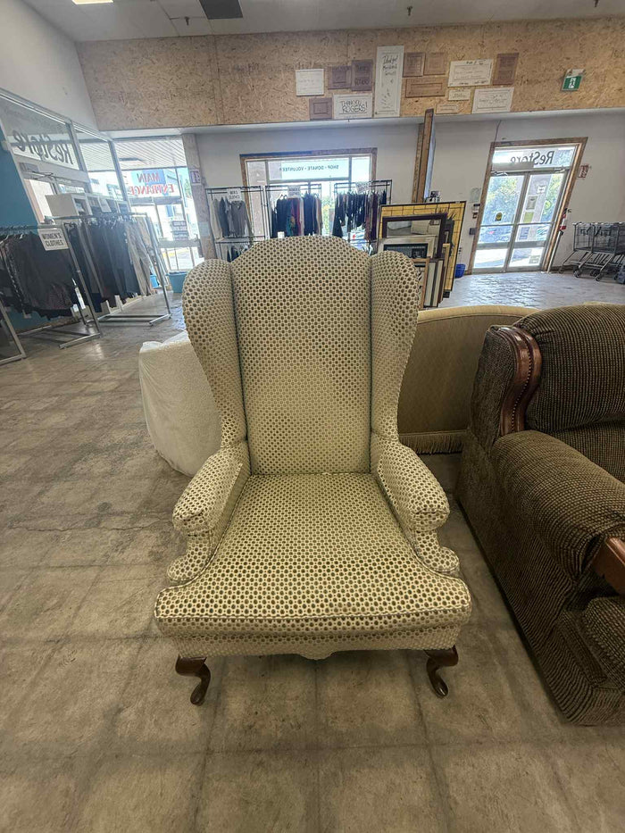 Light Colored Upholstered Wingback Armchair