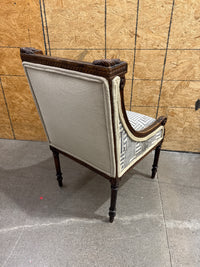 Antique French Louis XVI-style Carved Wood Armchair Features a Striking Geometric-Patterned Fabric Upholstery.