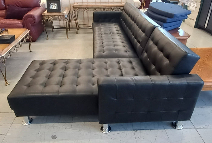 Black Vinyl Sectional Sofa with Silver Legs
