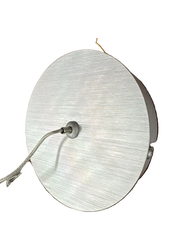 Modern Silver Pendant Light Fixture With A Textured Cylindrical Base.