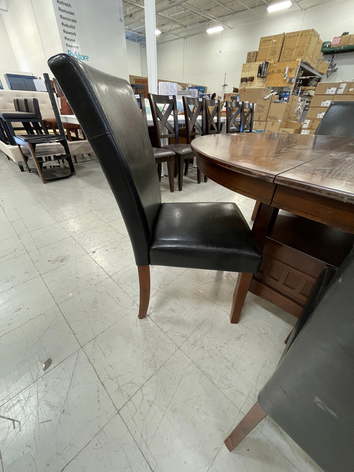 48 in. x 65 in. Wooden Oval Dining Table with 6 Black Leatherette Chairs