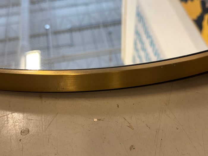 Round Wall Mirror With a Thin Metallic Frame