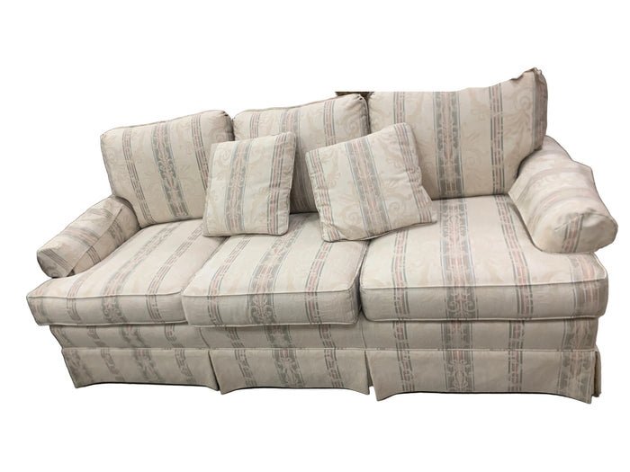 Cream Sofa With Blue And Pink Accents