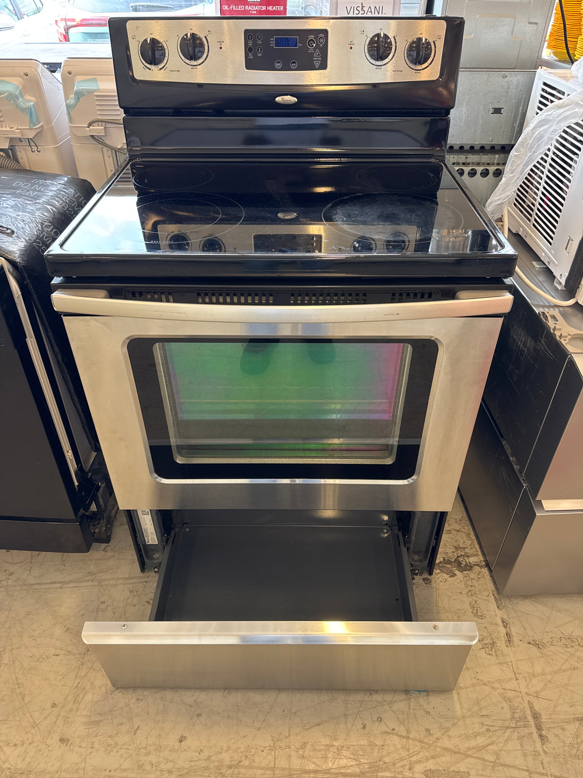 Whirlpool Freestanding Electric Stove Features A Stainless Steel Finish And A 4-Burner Ceramic Glass Cooktop.