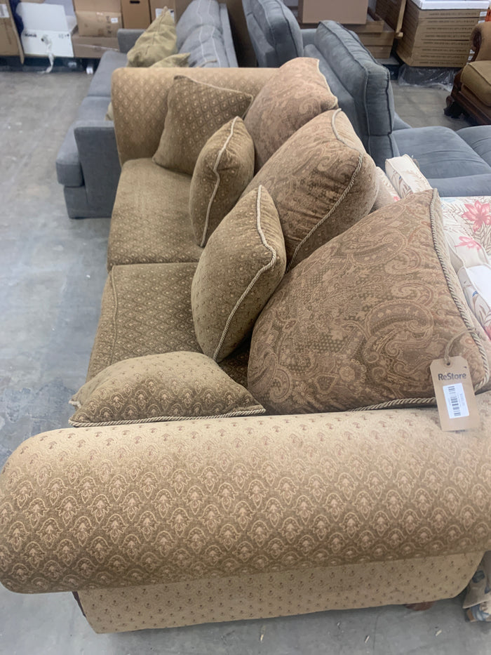 Brown Loveseat With Wooden Trim Accents