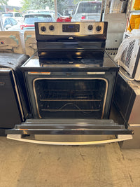 Whirlpool Freestanding Electric Stove Features A Stainless Steel Finish And A 4-Burner Ceramic Glass Cooktop.