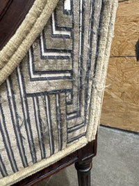 Antique French Louis XVI-style Carved Wood Armchair Features a Striking Geometric-Patterned Fabric Upholstery.