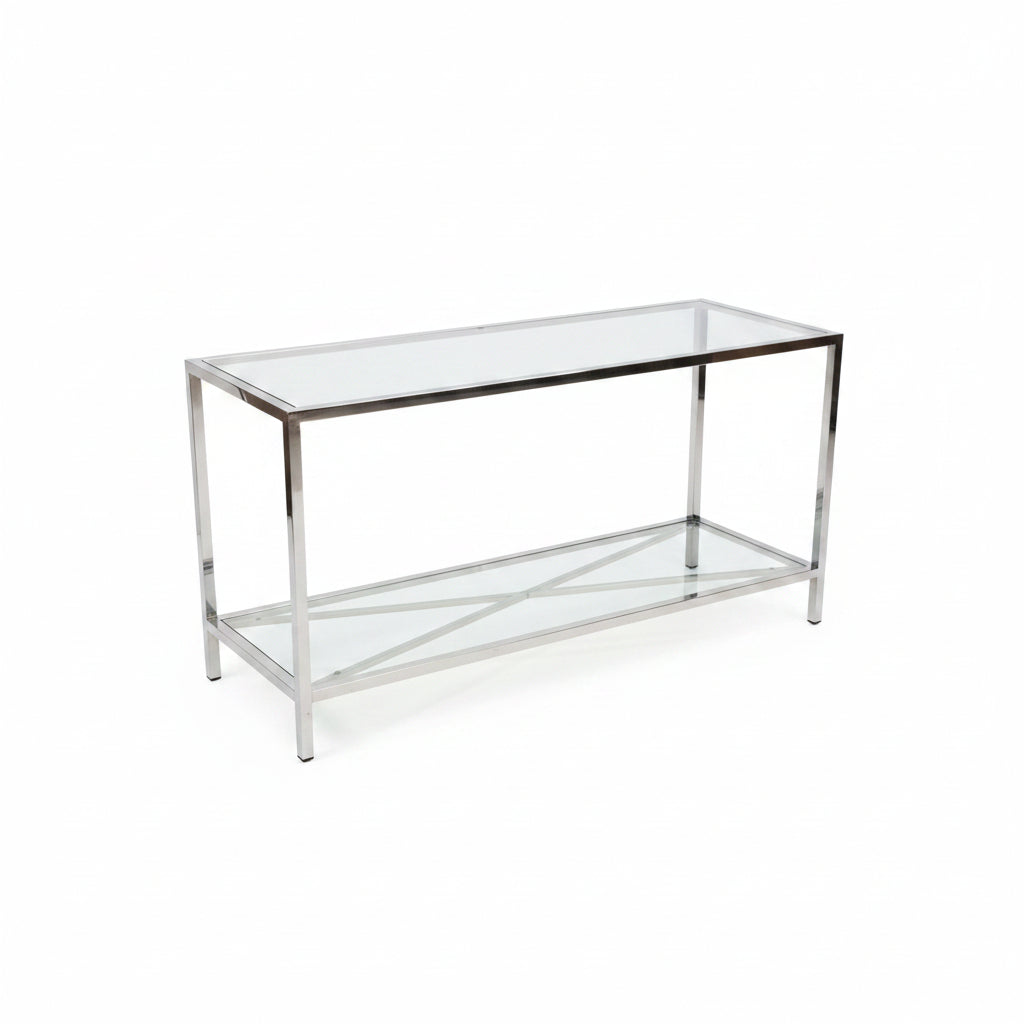 A two-tier glass display case with a polished chrome metal frame, photographed in a warehouse or showroom setting on a concrete floor.