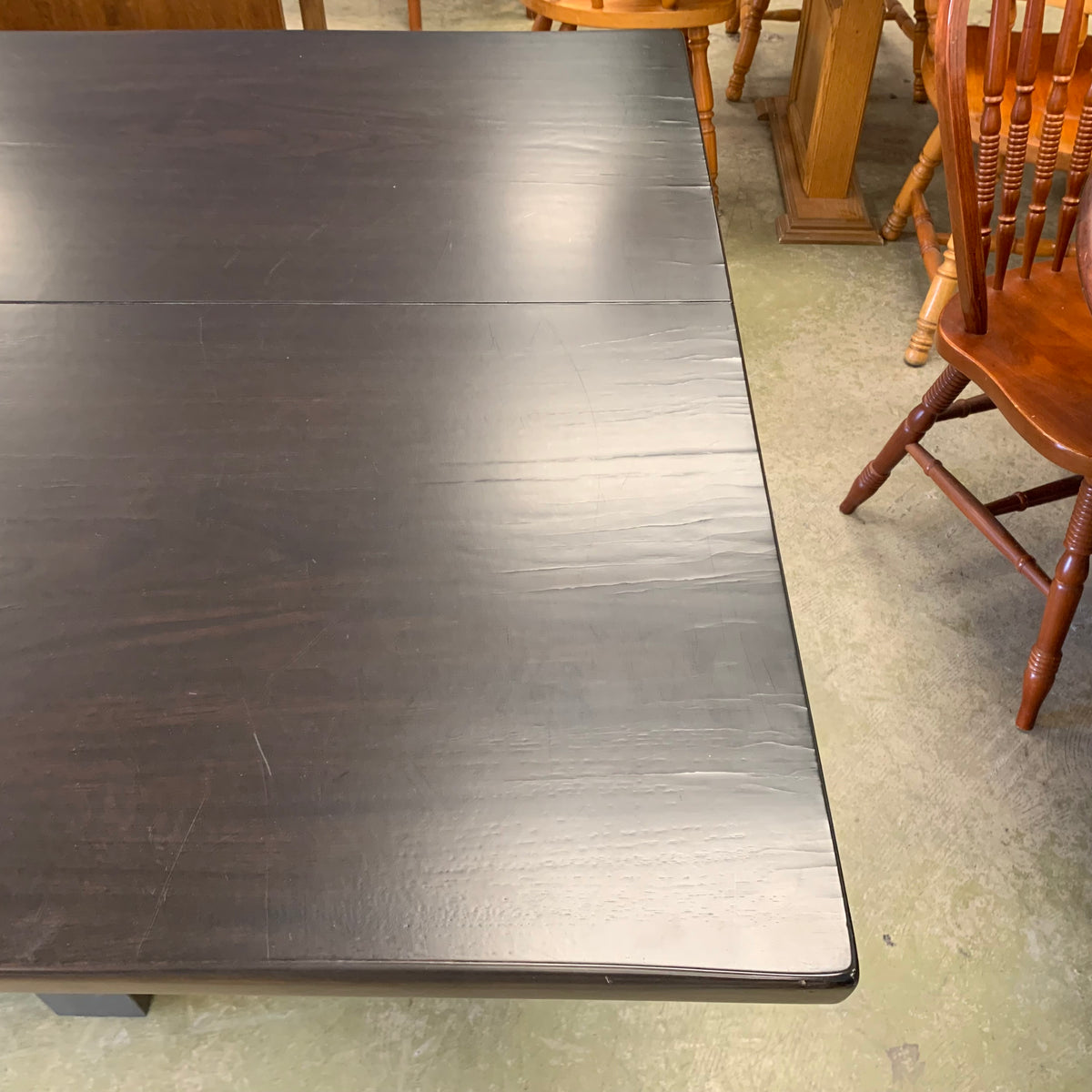 120-Inch W Summit Dining Table – Textured Dark Wood with Sculptural Base