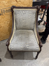 Antique French Louis XVI-style Carved Wood Armchair Features a Striking Geometric-Patterned Fabric Upholstery.