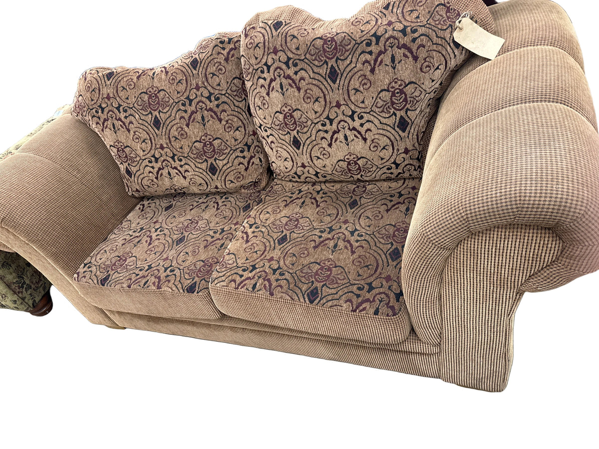 Brown Loveseat With Patterned Cushions