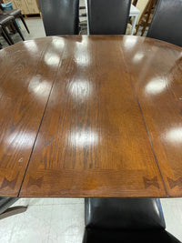 48 in. x 65 in. Wooden Oval Dining Table with 6 Black Leatherette Chairs