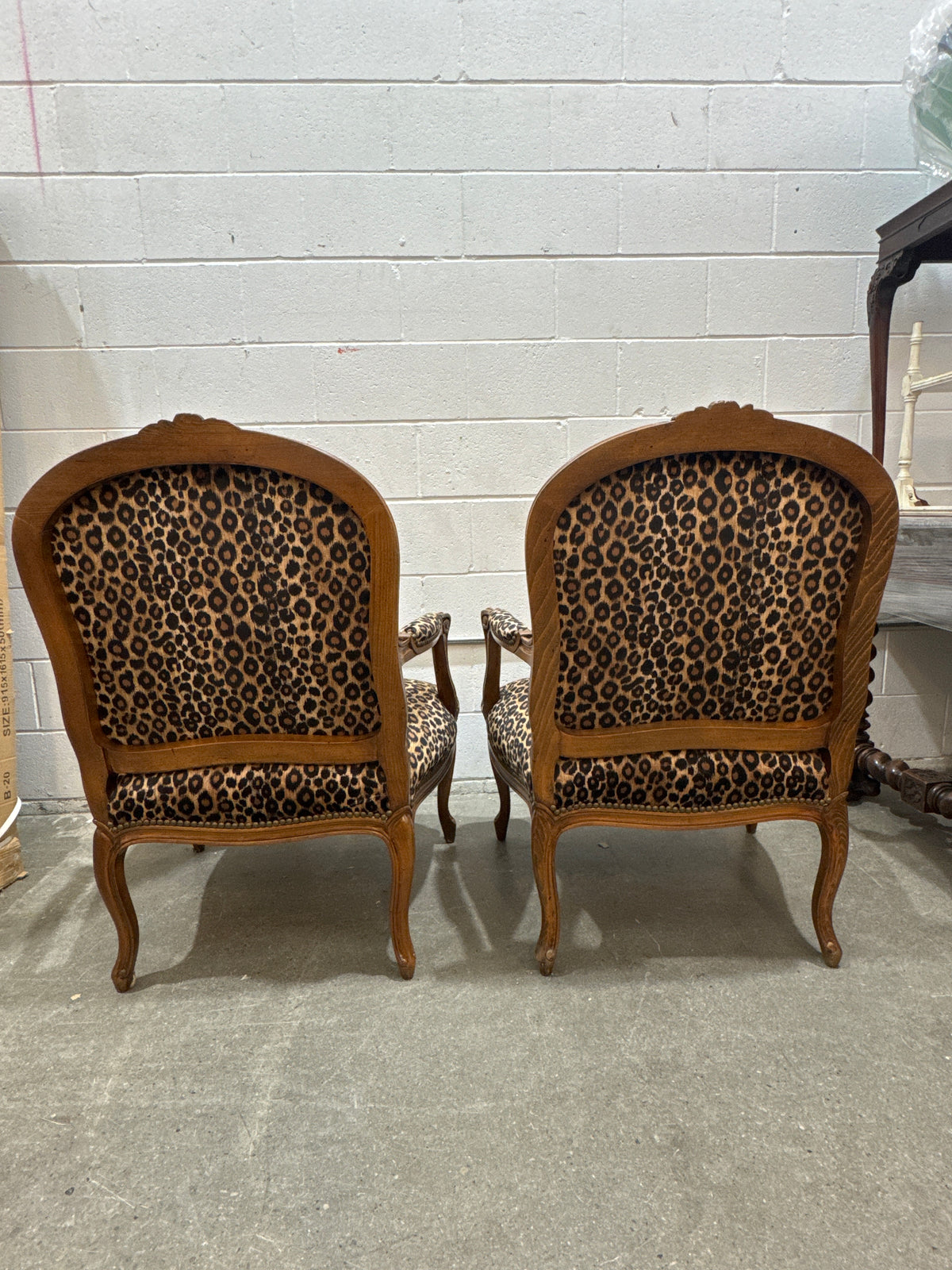 Vintage French Louis XV-style Carved Wood Armchair Featuring Striking Leopard-Print Upholstery and Elegant Cabriole Legs.