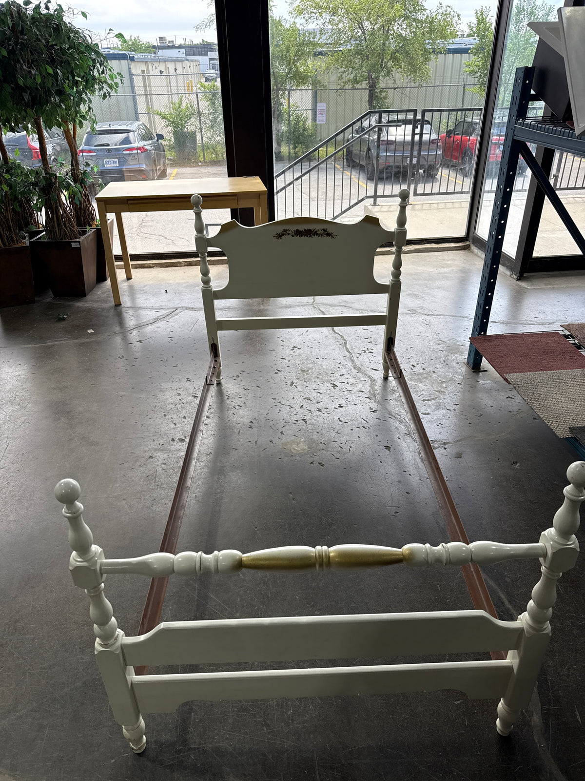 Single White Bed Frame With Small Flower Painted In The Head Board