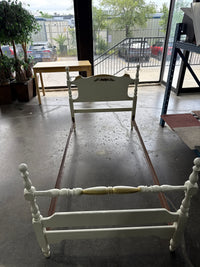 Single White Bed Frame With Small Flower Painted In The Head Board