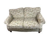 Cream floral patterned love-seat
