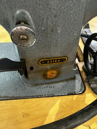 Singer 331K4 Industrial Sewing Machine with a Table