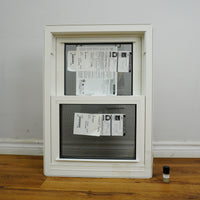 20x28-Inch Double Hung Window in Sandstone with Spring Screen