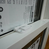 20x28-Inch Double Hung Window in Sandstone with Spring Screen