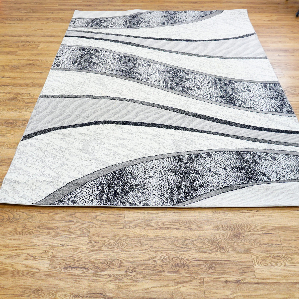 10.5 x 7.9 ft Abstract Wave Pattern Area Rug – Black, White & Gray