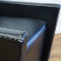 28×32×33‑Inch Black Leather Armchair – Angular Profile, Cushioned Seat & Back