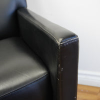 28×32×33‑Inch Black Leather Armchair – Angular Profile, Cushioned Seat & Back
