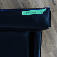 28×32×33‑Inch Black Leather Armchair – Angular Profile, Cushioned Seat & Back