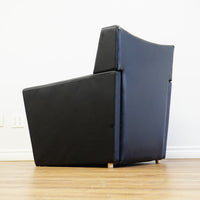 28×32×33‑Inch Black Leather Armchair – Angular Profile, Cushioned Seat & Back