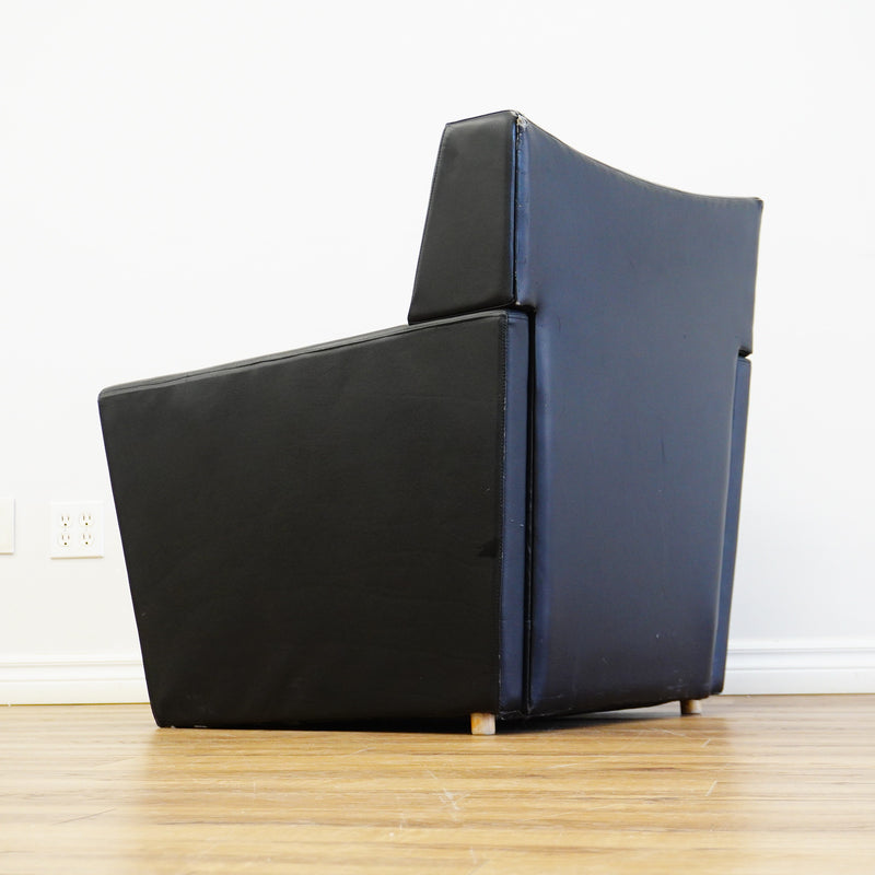 28×32×33‑Inch Black Leather Armchair – Angular Profile, Cushioned Seat & Back
