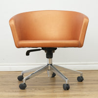Faux Leather Chair with Wheels in Brownish Orange