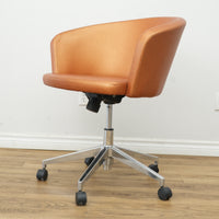 Faux Leather Chair with Wheels in Brownish Orange