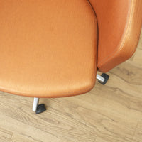 Faux Leather Chair with Wheels in Brownish Orange