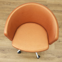 Faux Leather Chair with Wheels in Brownish Orange
