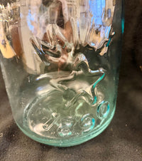 Antique Late 19th-Century Aqua Glass Bottle with Embossed Stars and Panels